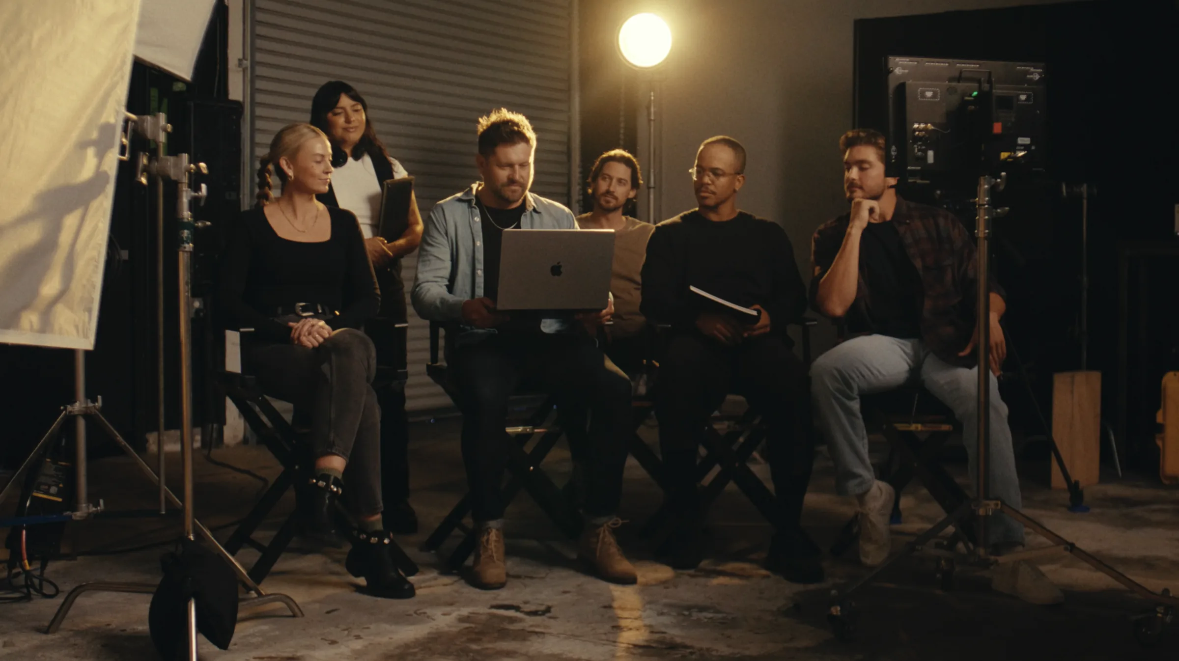 Creative team reviewing work together on a film set